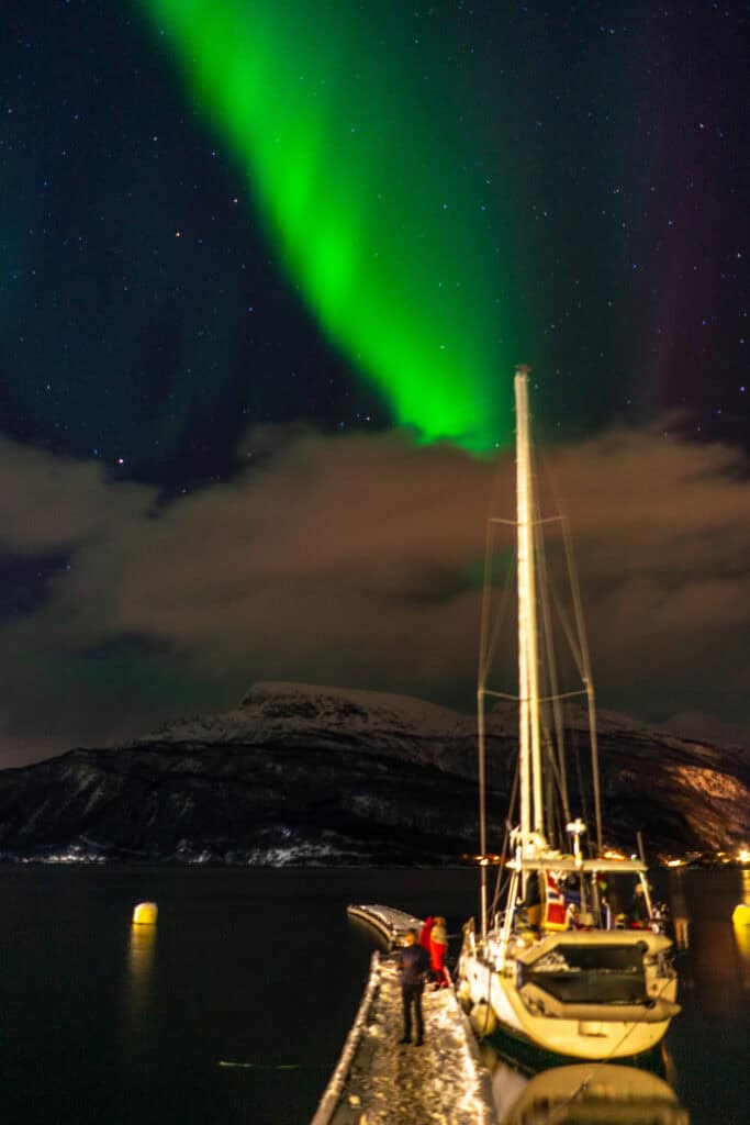 Northern lights above the sailing ship