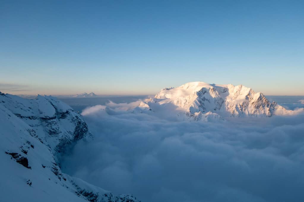 Sunrise over the sea of fog in the Grand Combin massif