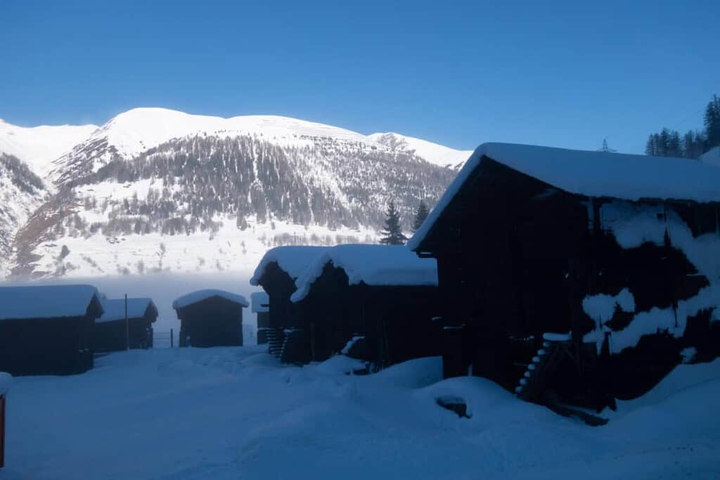 Snow-covered huts in the Binn Valley