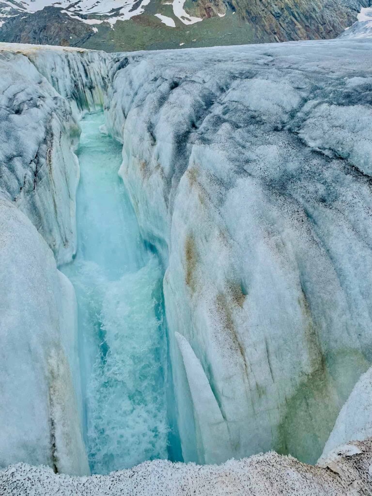 Water falling into a glacier mill on the Aletsch Glacier.