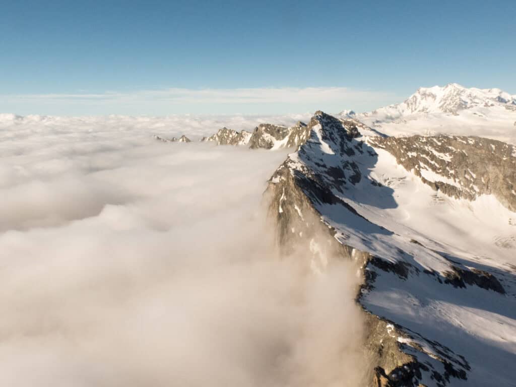 View from above of the Portjengrat above the clouds